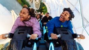 Several people on Tron riding the roller coaster